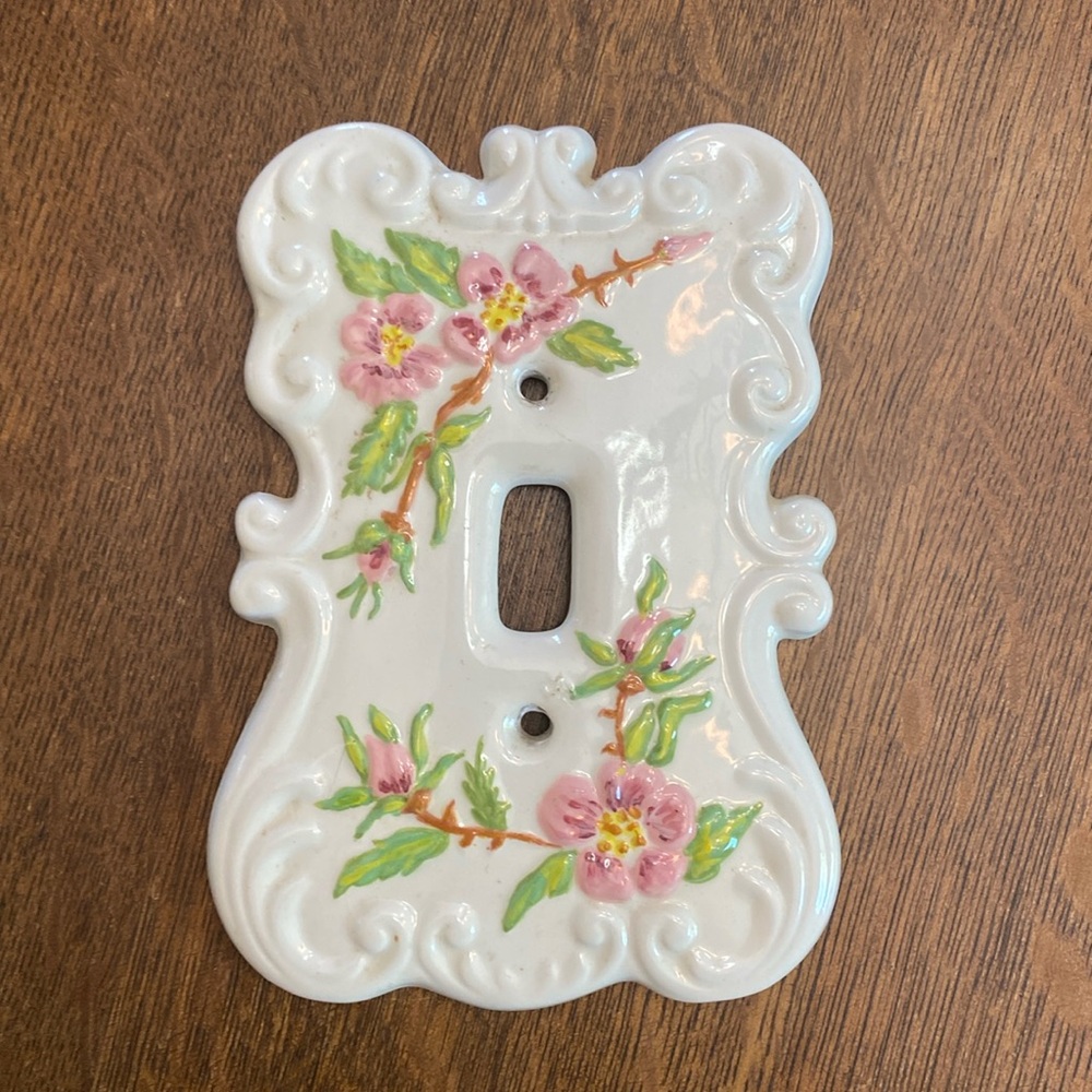 Hand painted ceramic light switch plate.
